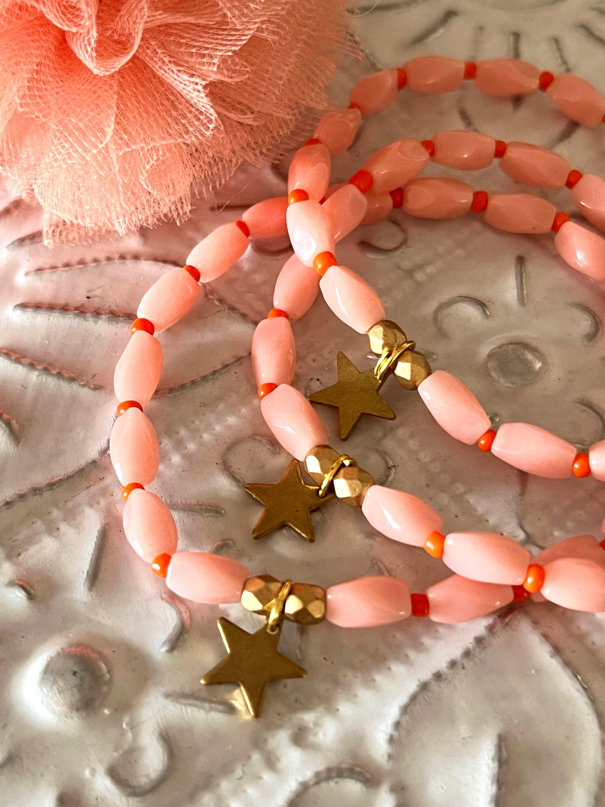 Charleston - bracelet rose orangé et breloque étoile Arastuce